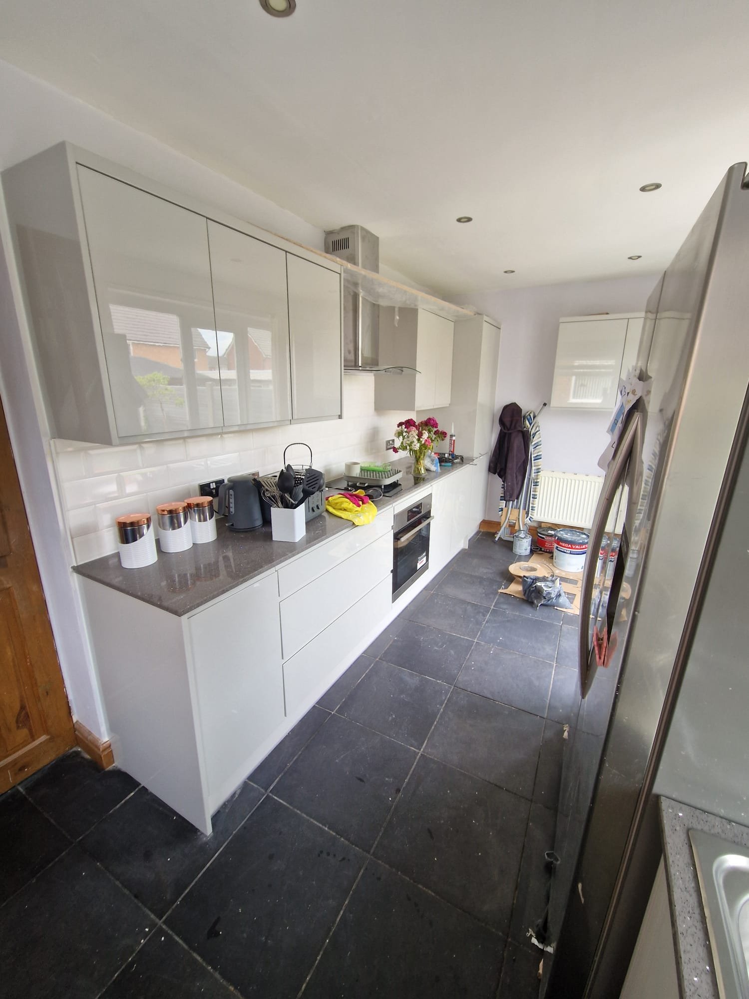 High-Gloss White Kitchen with Clean Linear Storage – Prestwich Kitchen Design Ideas