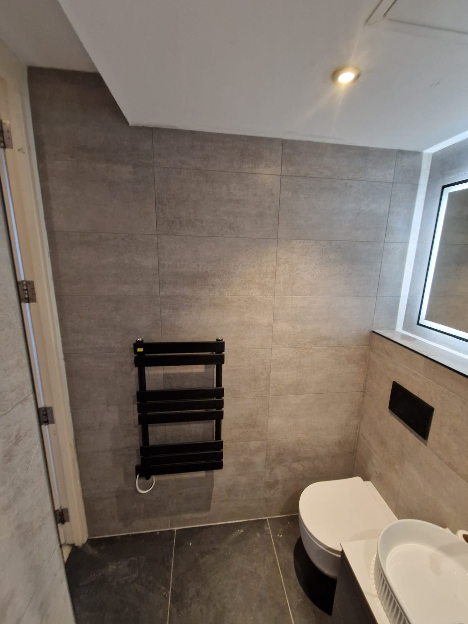 Minimalist Grey Bathroom and Black Heated Towel Rail – Wythenshawe Bathroom Design Ideas