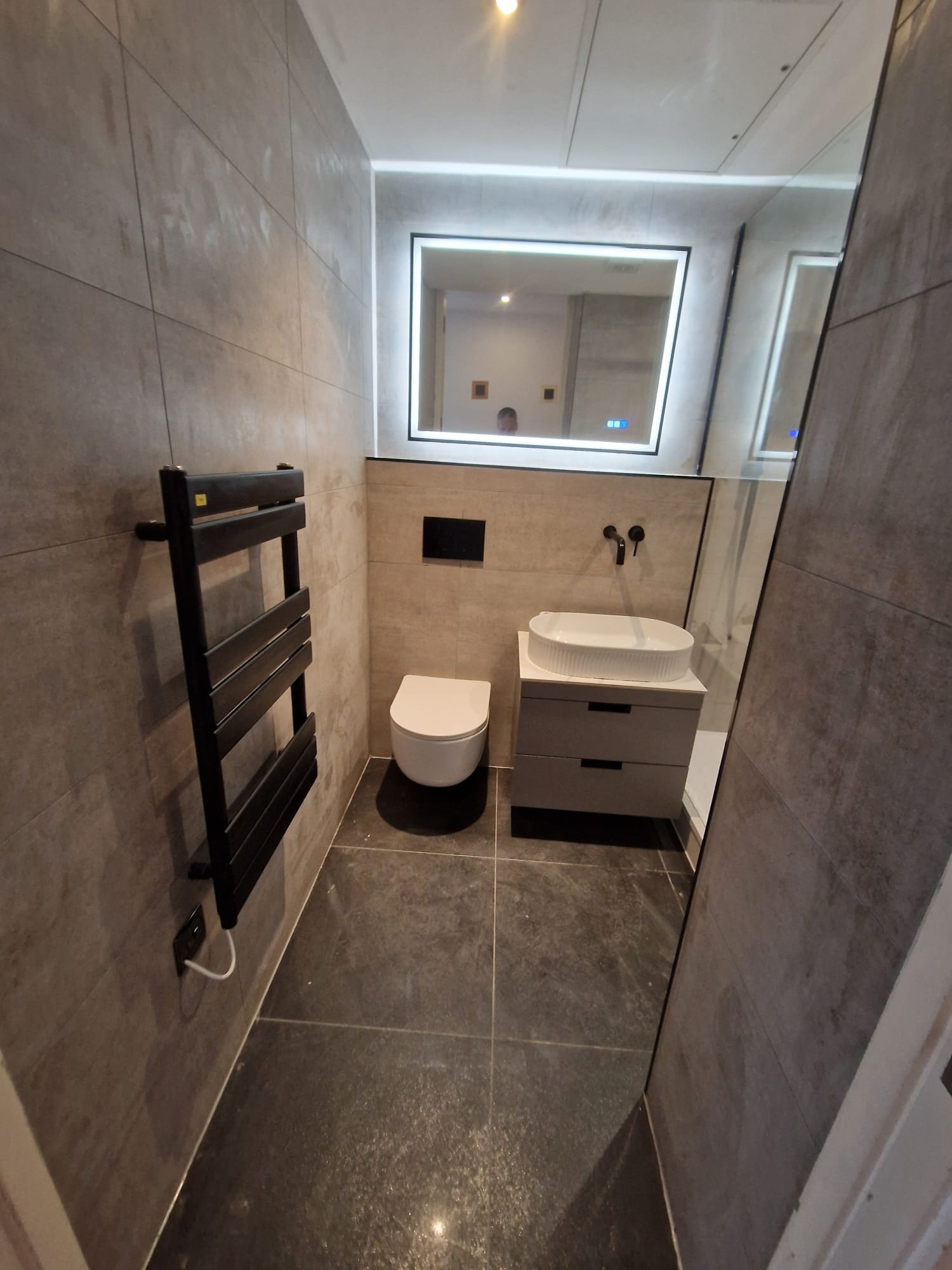 Modern Grey Bathroom with Wall-Hung Toilet and LED Mirror – Stretford Bathroom Design Ideas